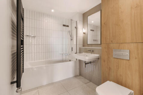 Experience the blend of style and function in this chic bathroom.