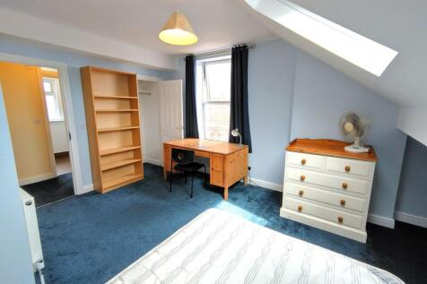 Bright, well-presented bedroom with a large win...