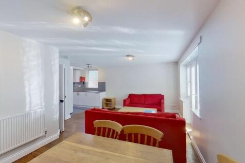 Bright open-plan living area with comfortable r...