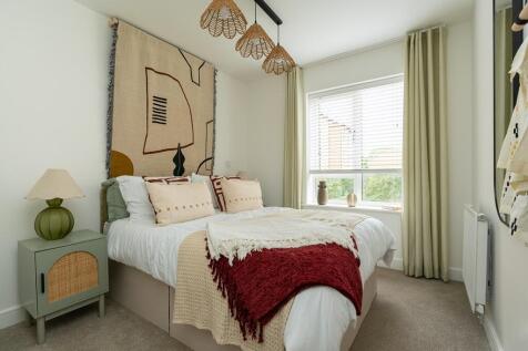 Bedroom 1 boasts a large window for plenty of natural light