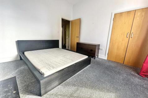 Spacious double bedroom with built-in storage...
