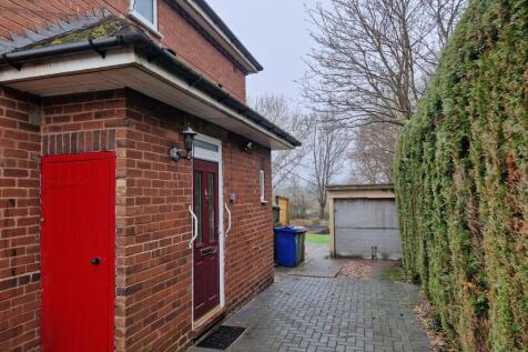Entrance to property and garage front