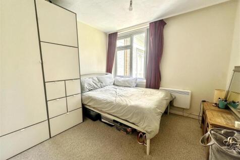 Bright bedroom with wardrobe and window...