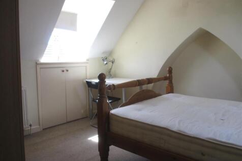 Bright bedroom with desk and unique alcove...