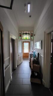 Bright hallway with stunning stained glass deta...