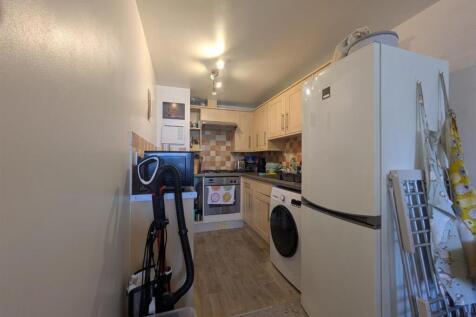 Fully equipped kitchen with essential appliance...