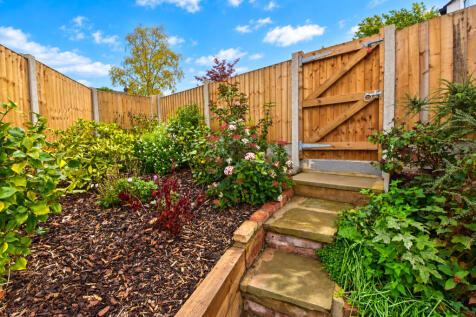 Lush Garden Courtyard with Timber Gate