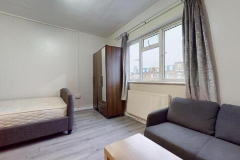 Bright furnished bedroom with a comfortable sin...