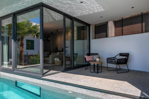 Open-plan living area with seamless transition to the pool area