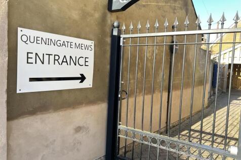 Secure gated entrance with clear signage...