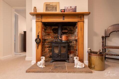 Log burner in Entrance Hall