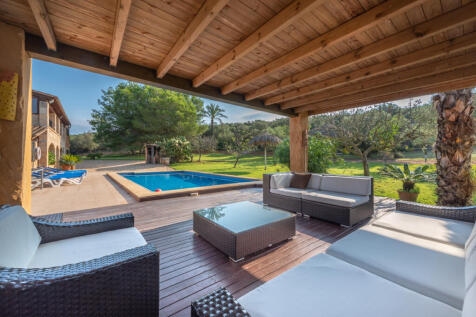 Large lounge terrace next to the pool