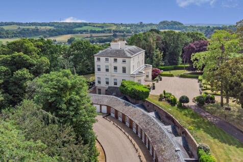 side with garage and pool house