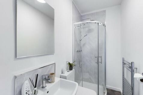 A modern and clean bathroom featuring a stylish...