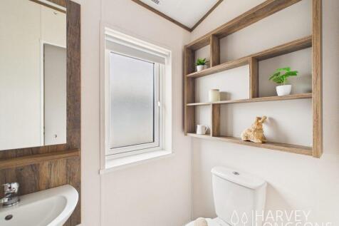 Shower room basin and mirror in Willerby Malton El