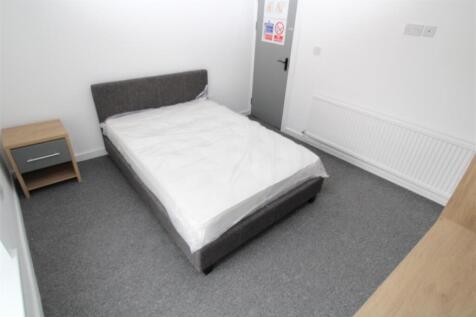 Modern double bedroom with fresh grey carpets...