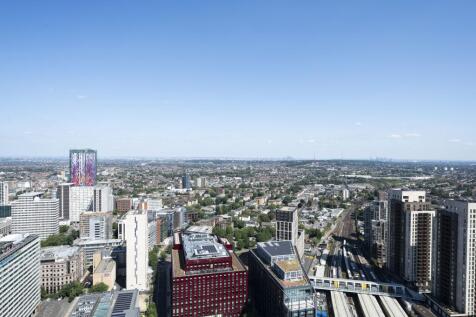 Experience the breathtaking urban panorama from this luxurious apartment's vantage point.
