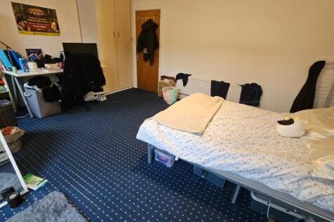 Spacious bedroom with a dedicated study area...