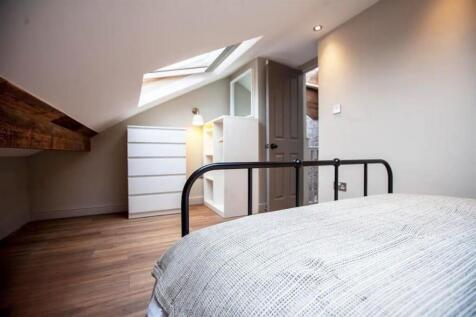 Bright attic double bedroom with skylight...