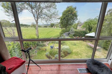 L Shaped Lounge through Dining Room