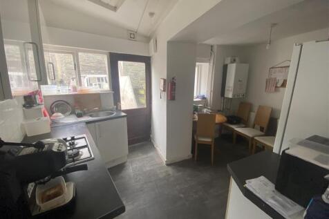 Bright kitchen with a dining area and garden do...