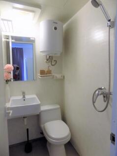 Bright, tidy bathroom with compact fixtures inc...