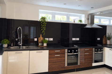Sunlit Minimalist Kitchen with Greenery.png