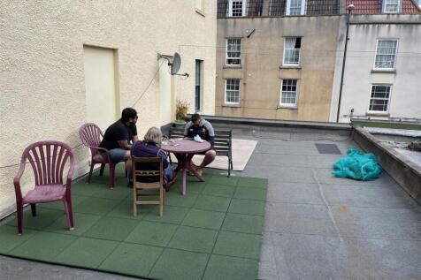 Spacious outdoor terrace with seating area...