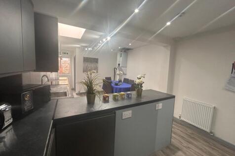 Modern kitchen with island and dining area...