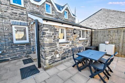 Front view of property and patio