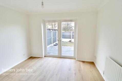 Bright living room with patio doors...