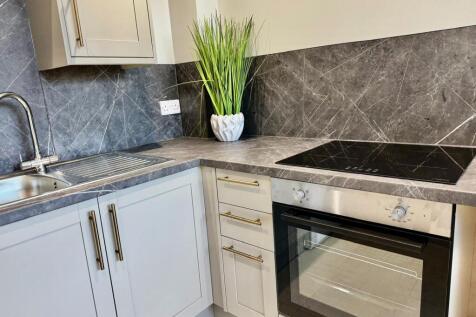 Modern kitchen with sleek marble splashback...