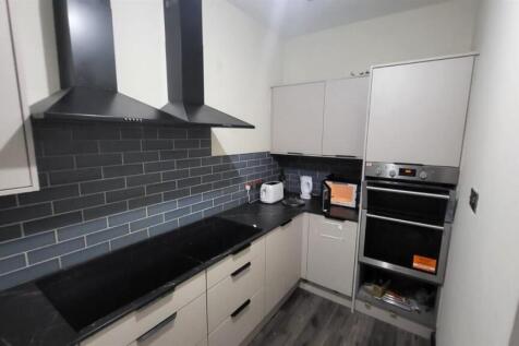 Modern kitchen with sleek dual cooking areas...