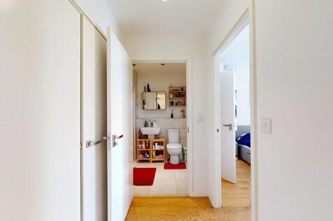 Bright and modern hallway with clean white wall...