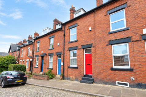 Bright Red-Brick Terrace with Colorful Doors