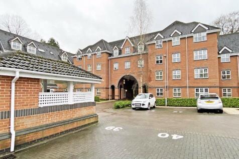Modern brick development with parking and archw...