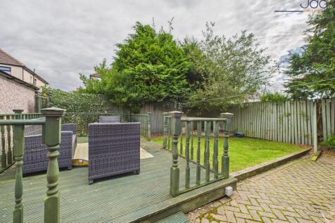 Spacious Garden with a mixture of lawn, decking and brick