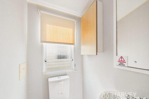 Additional toilet with wash basin and storage