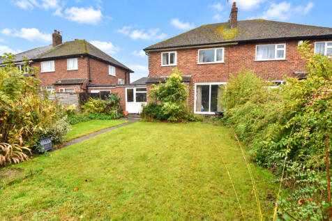 Sunny Suburban Garden and Brick House