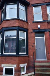 The exterior front of a traditional red brick p...