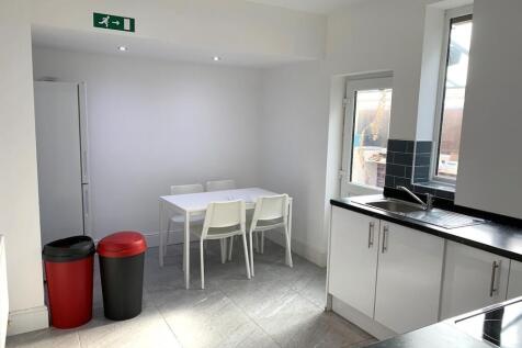 A bright and modern kitchen featuring a sleek b...