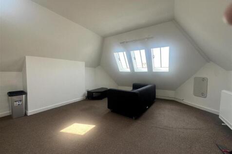 Bright attic lounge with natural skylights...