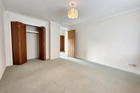 Spacious bright bedroom with built-in storage...