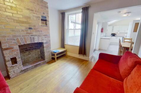 Bright and inviting living room featuring a cha...