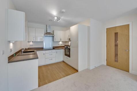 a kitchen with white cabinets