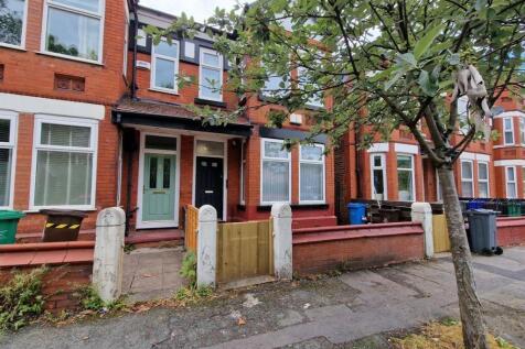 Charming red brick terraced house exterior...