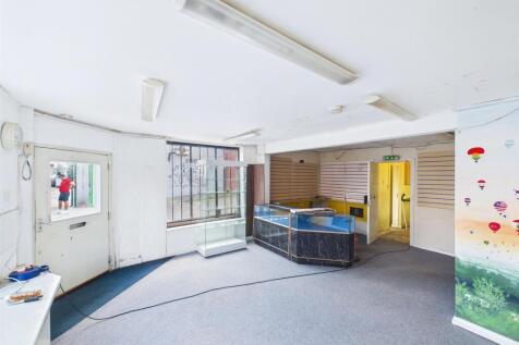2 - Vacant shop, one-bedroom flat &amp; rear workshop.