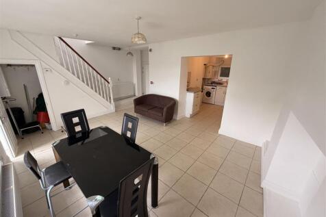 Bright open-plan living with stylish dining set...