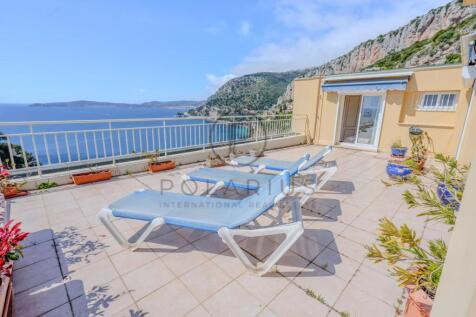 Spacious terrace with lounge chairs offering stunn