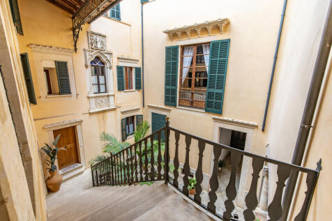 Staircase with a view of the courtyard
